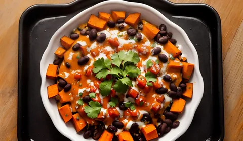 Loaded sweet potato nachos on an aluminum baking sheet. This is the designated pinterest pin.