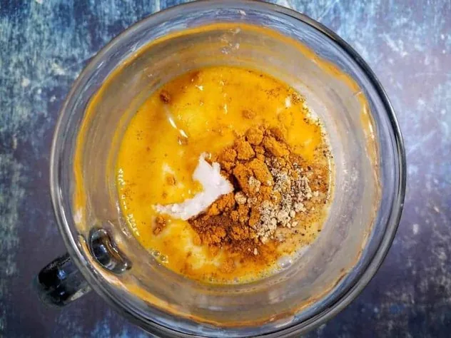 Golden Milk Latte Process Step 1 The spices and coconut oil have been added to the glass, but not yet mixed or microwaved.