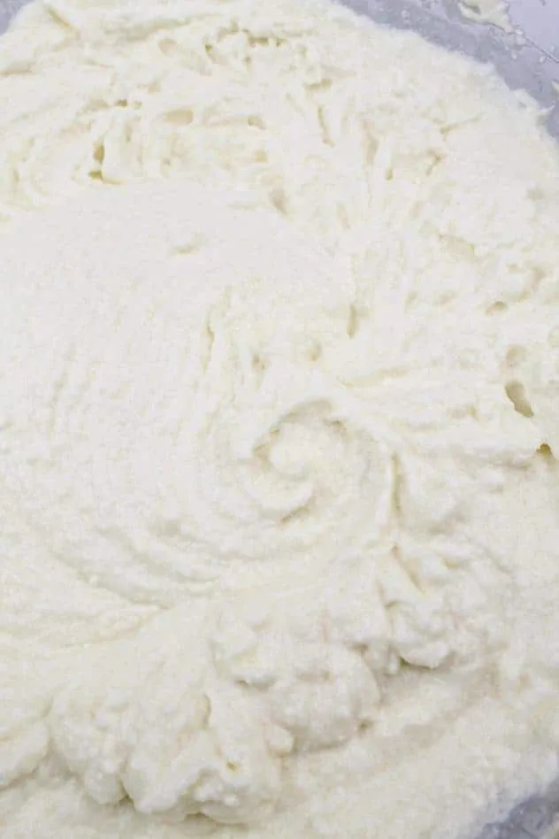 Gluten-Free Ricotta Cookies Process Step 2b Mixing in ricotta and applesauce to the creamed mixture in a large glass bowl.